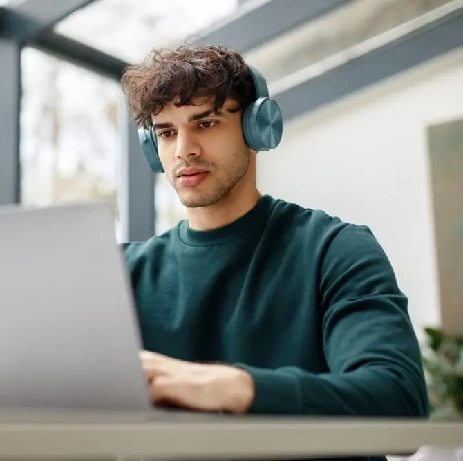 man focusing on his lap top